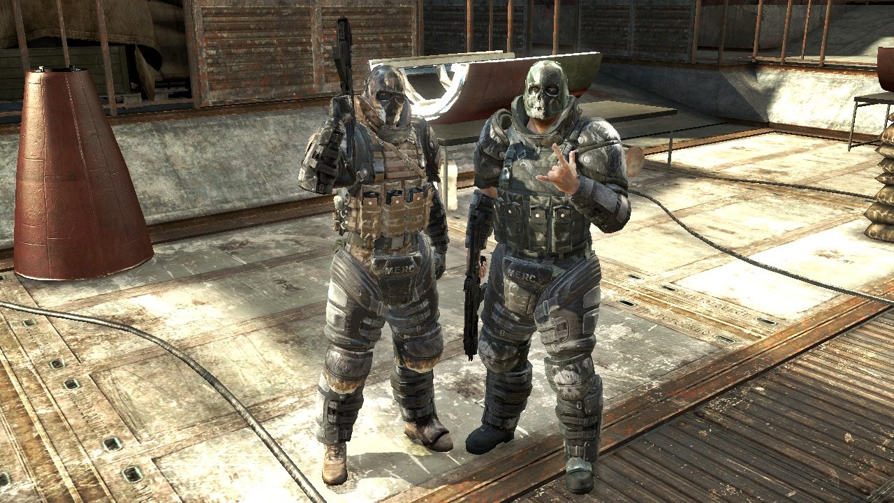 Dois mercenários armados em cenário de Army of Two original para Xbox 360
